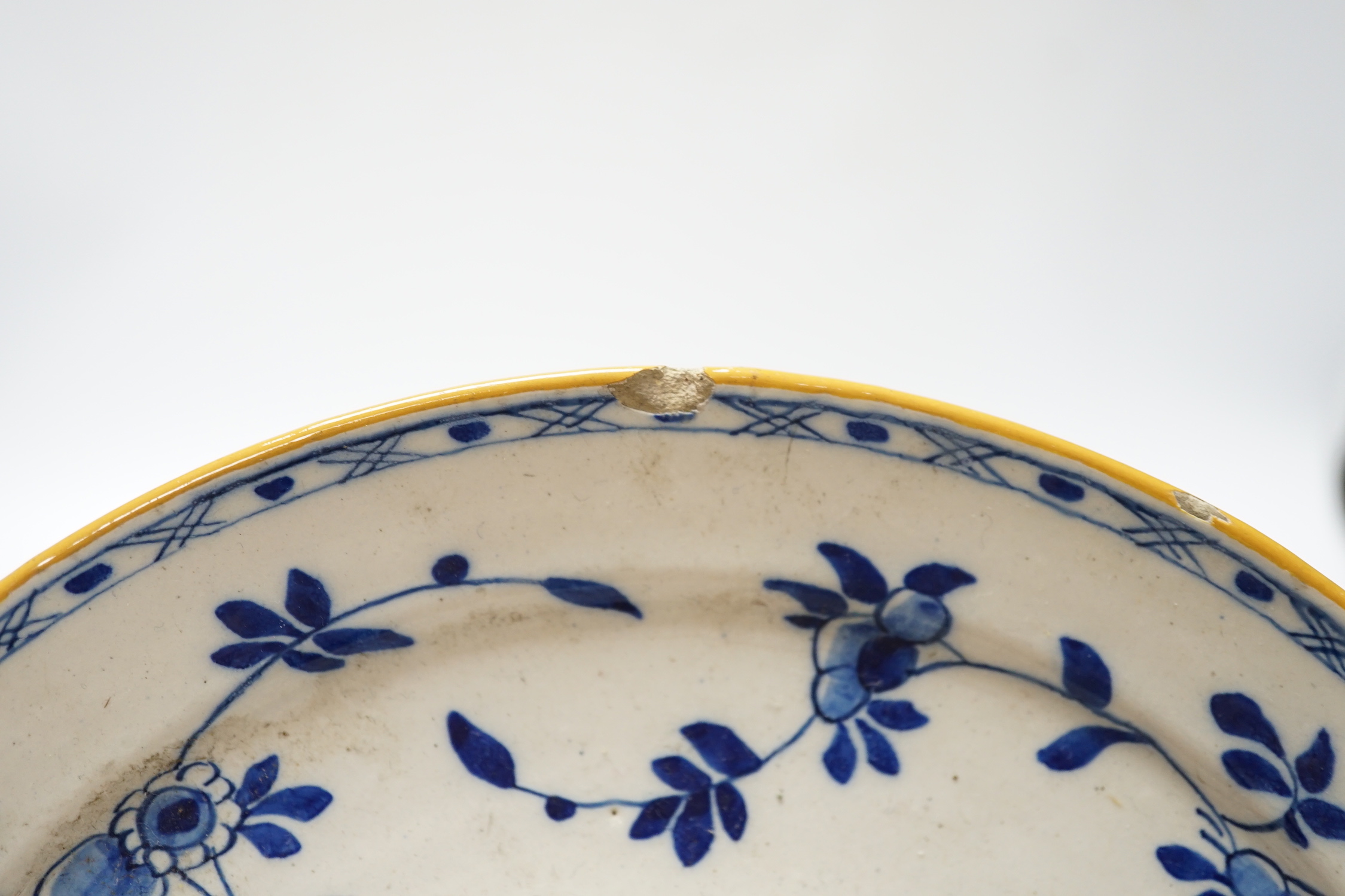 A pair of late 18th century Delft plates and an English delftware plate (3)